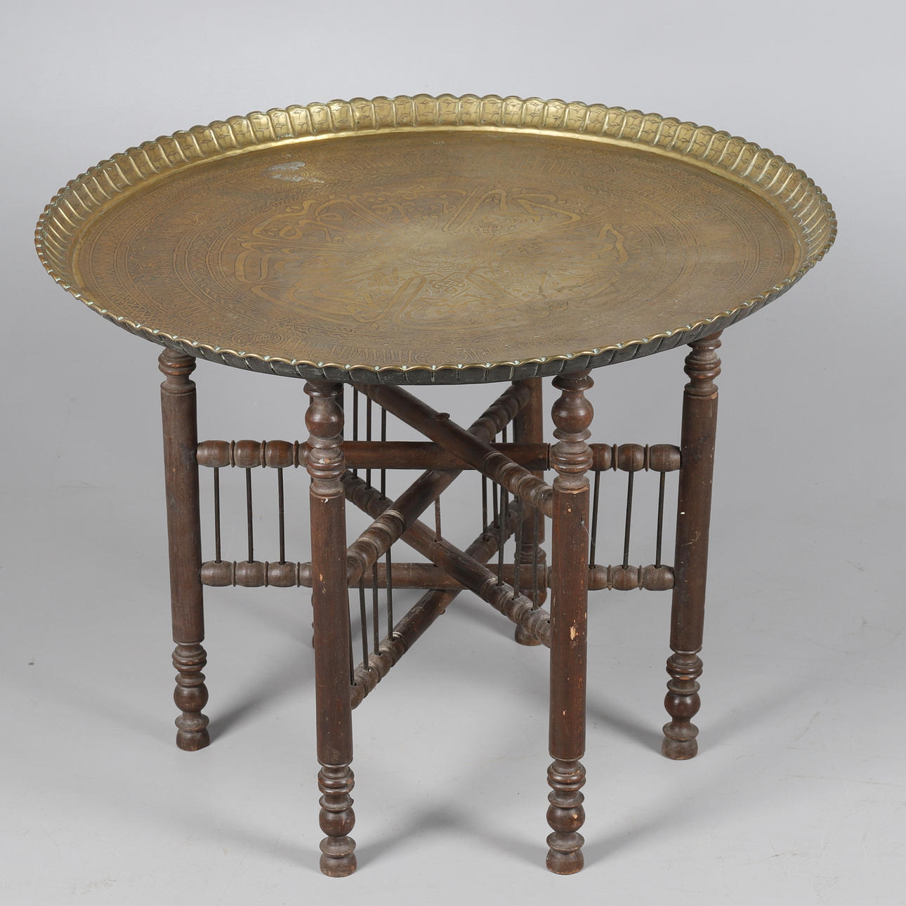 AN INDIAN BRASS BENARES WARE TIFFIN TABLE AND STAND.