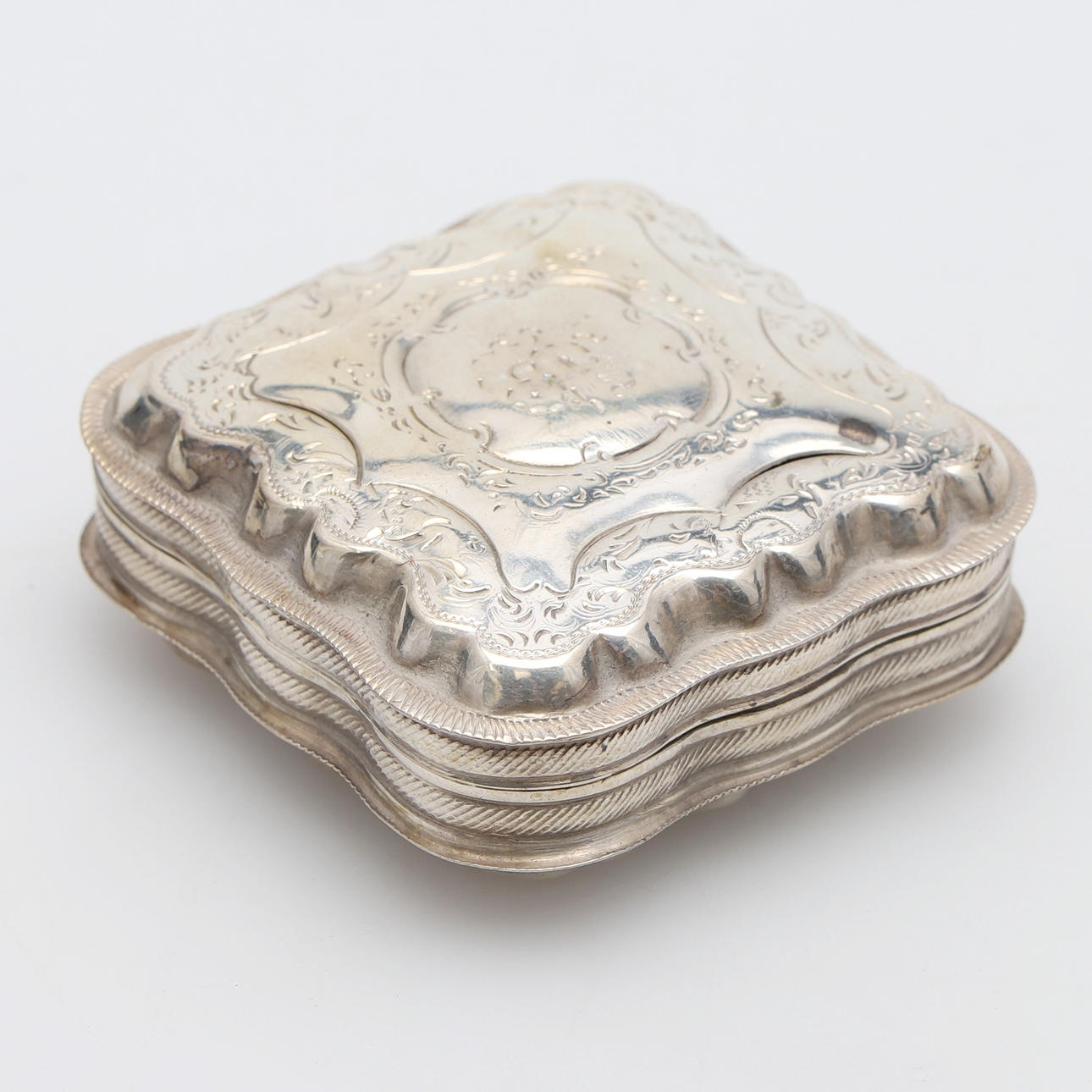 A 19TH CENTURY DUTCH SILVER SQUARE SHAPED BOX.