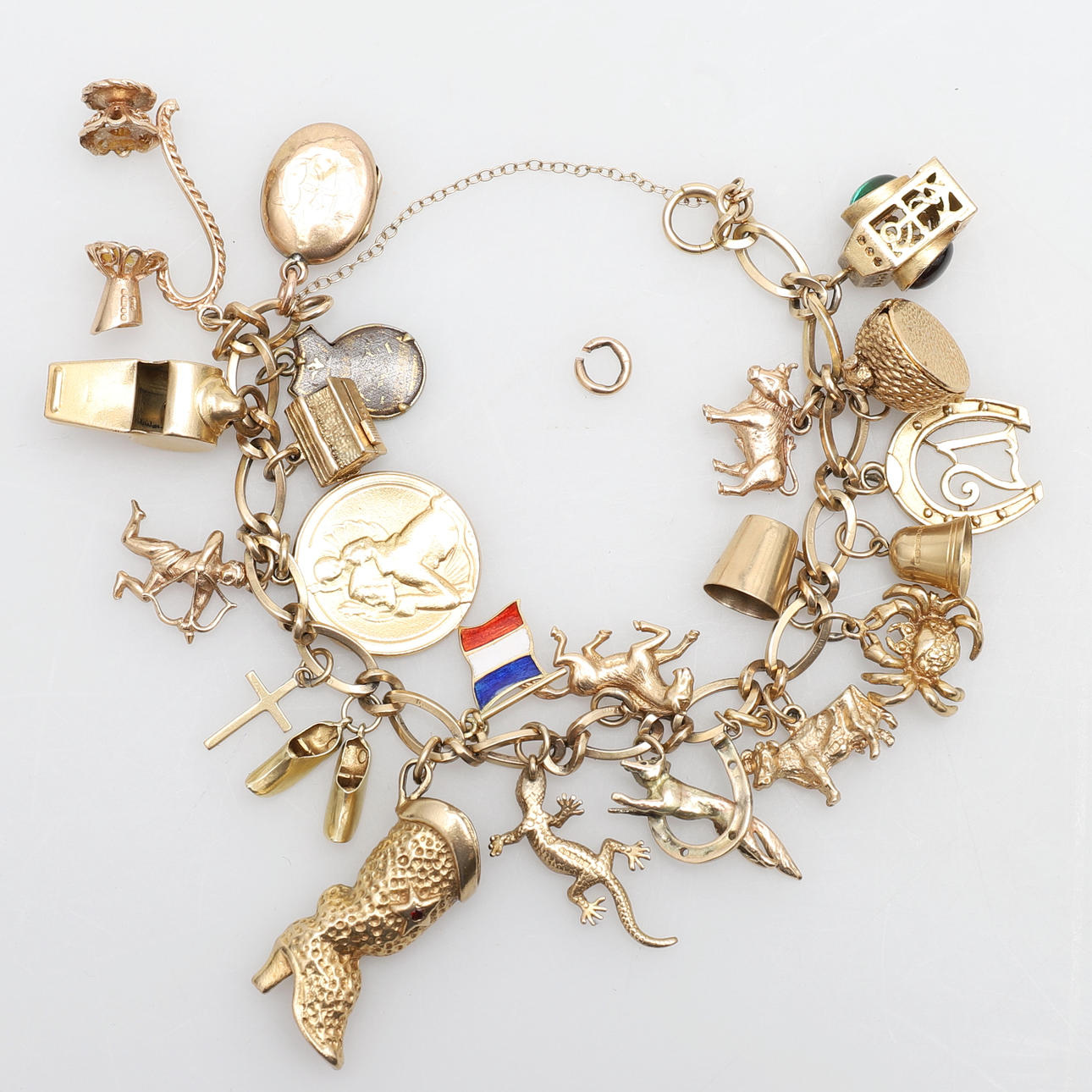 A GOLD CHARM BRACELET.