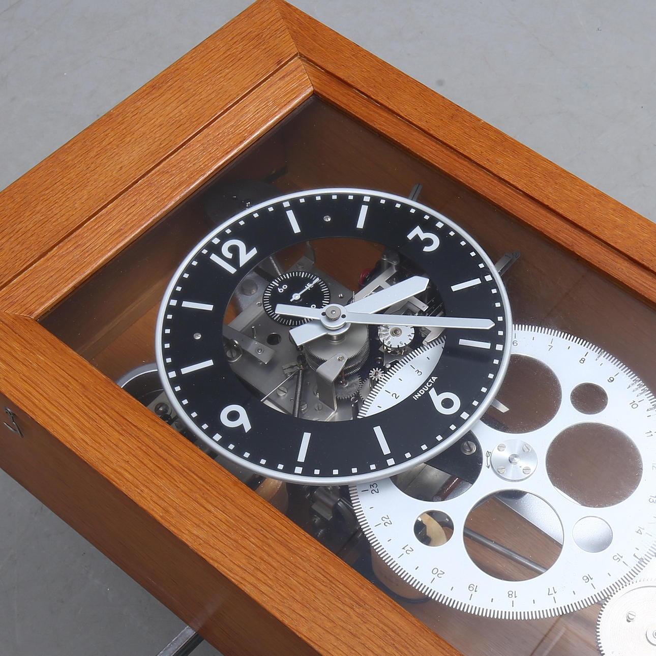 CENTRAL CLOCK, marked Inducta, oak case.