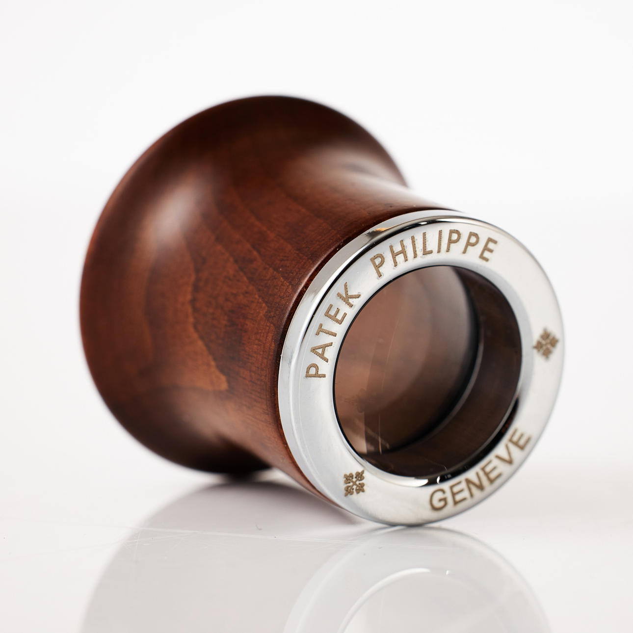 PATEK PHILIPPE, Lupe, Holz mit Metallfassung.