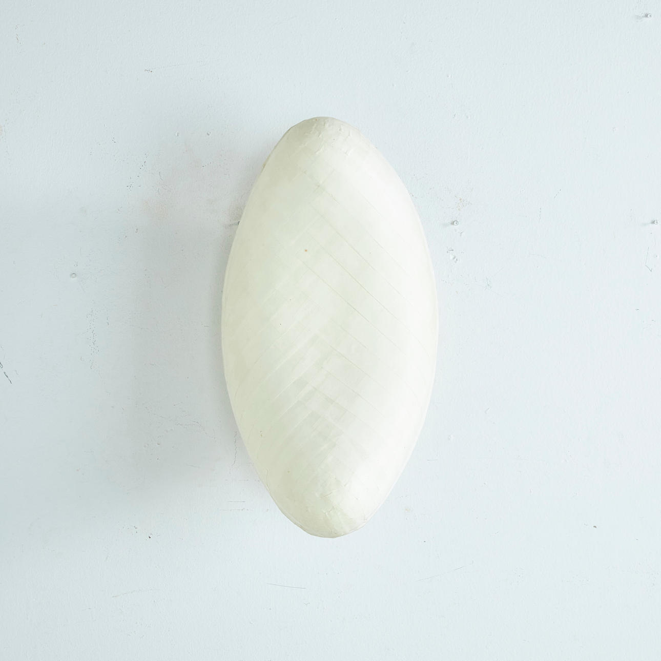 CELINE WRIGHT. WALL LAMP, kidney-shaped, signed.