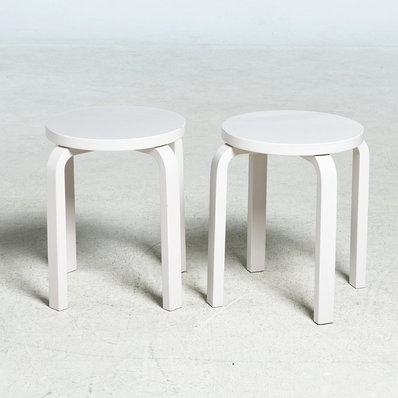 ALVAR AALTO. stool, "E60", gray lacquered birch, stackable, original label marked Artek, 2 pcs.