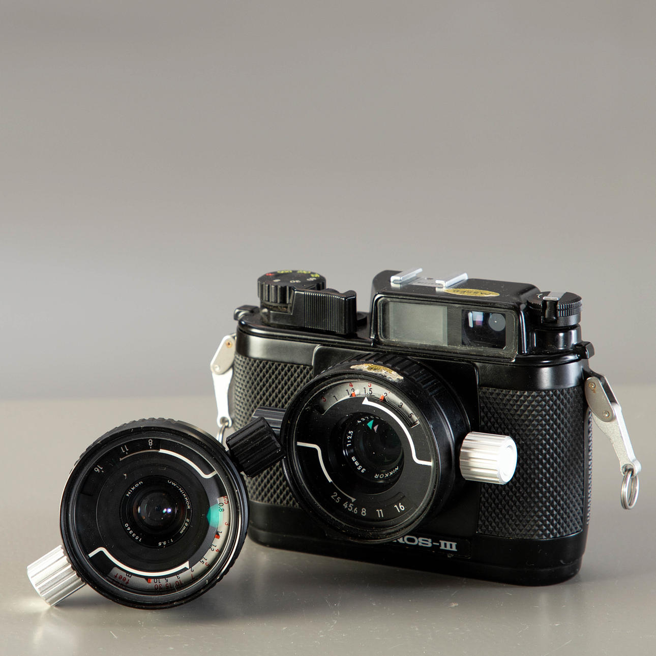 Nikon Nikonos-III with two lenses.