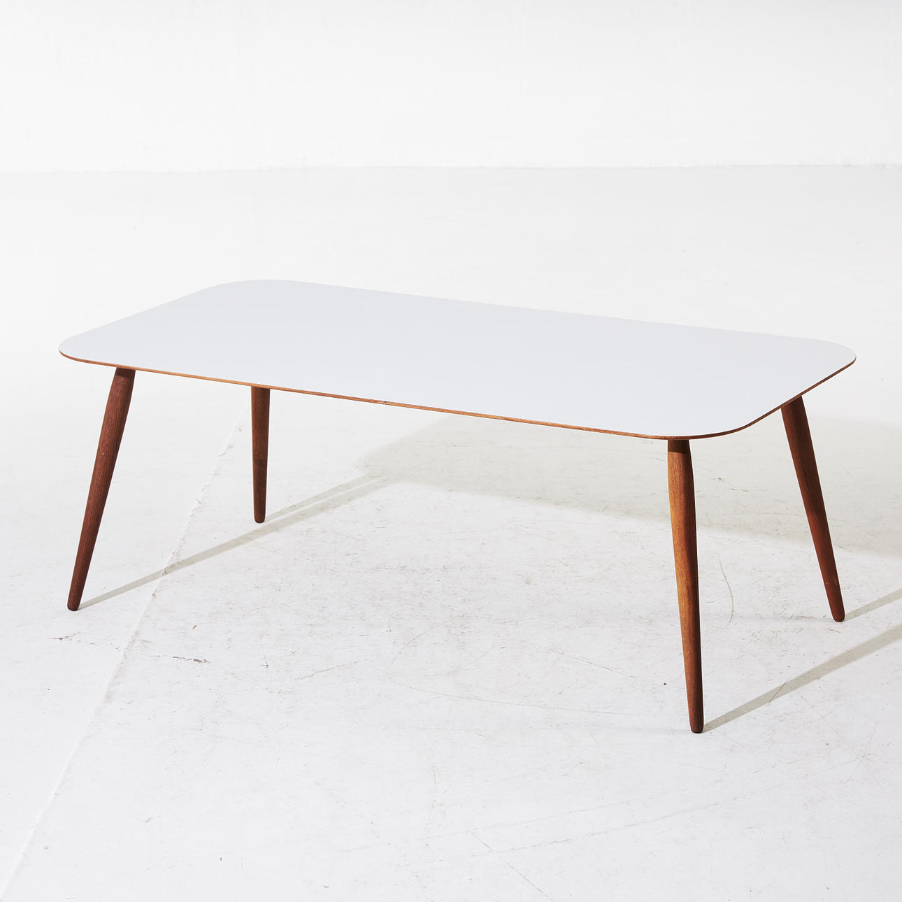 HENRIK J. BRUUN & JACOB S. MUNCH "Play rectangular", coffee table, BruunMunch, Denmark, frame in oiled oak, top of top in white laminate, label underneath.