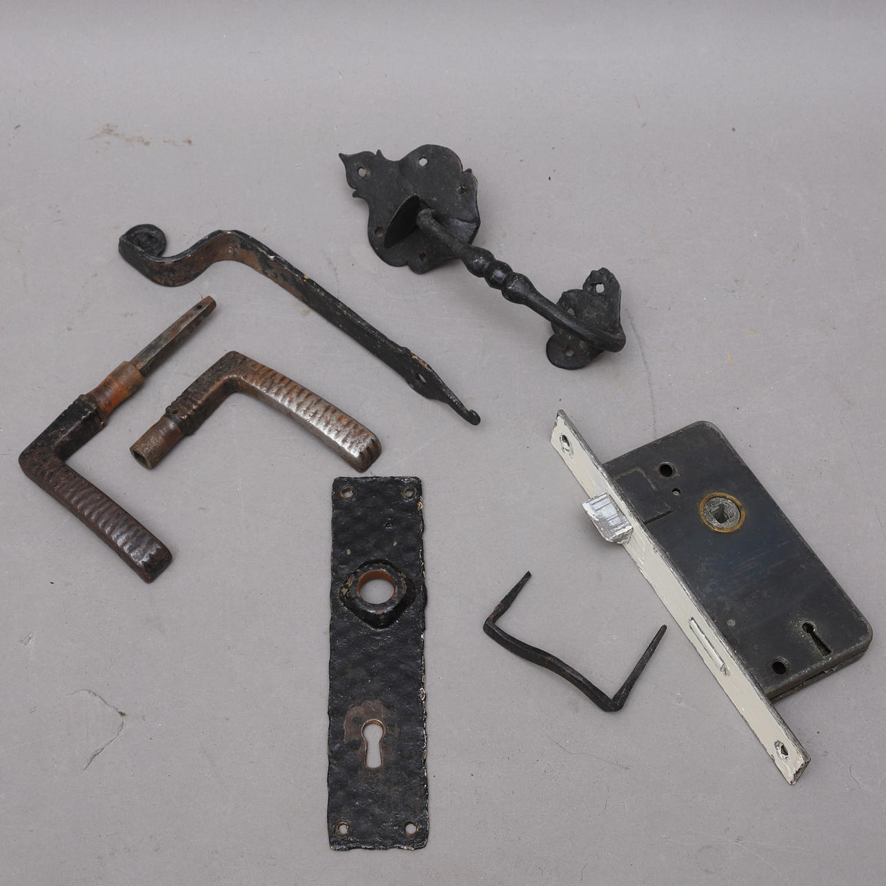 LOCK, HANDLE & DOOR HARDWARE, 7 pcs., wrought iron, 1900s.