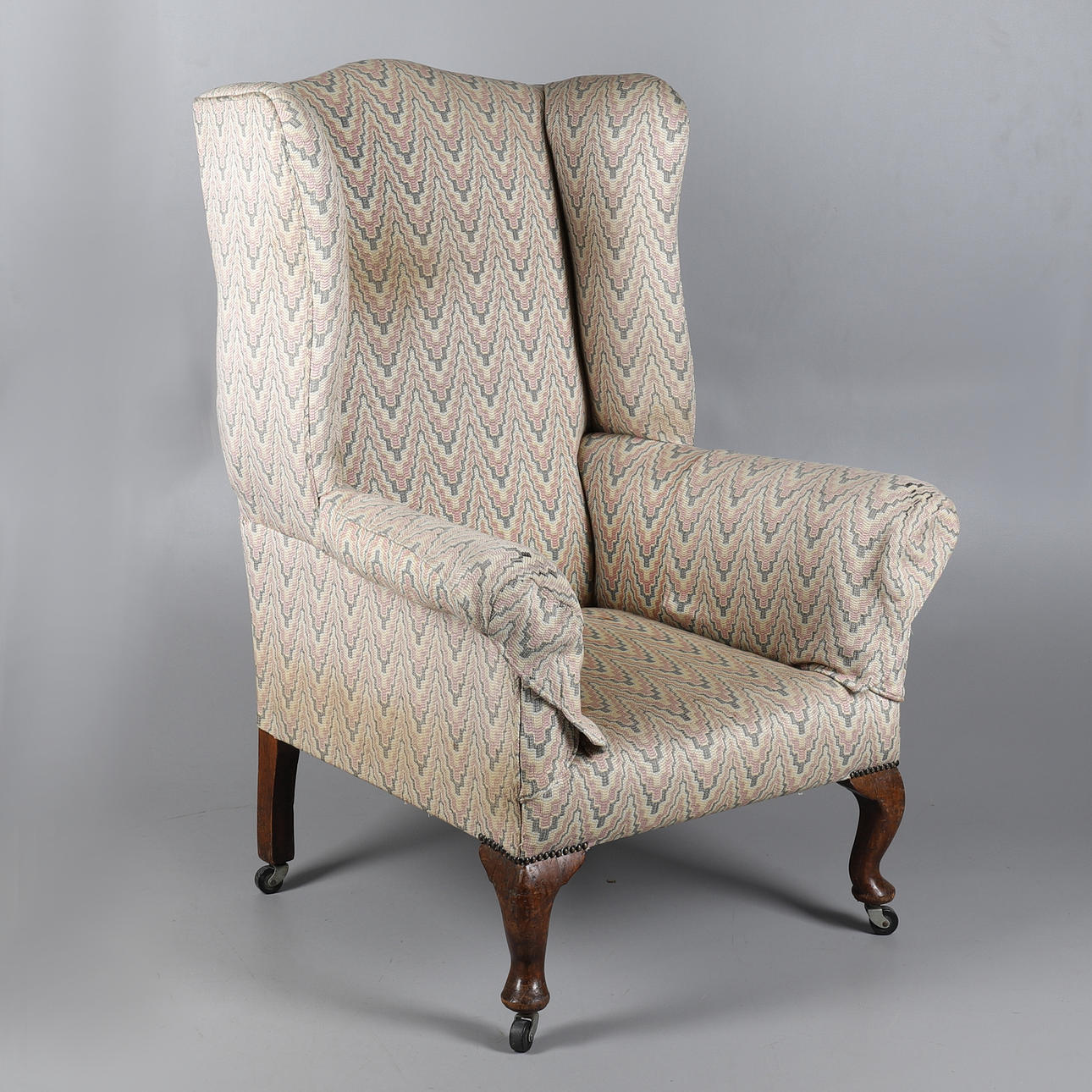 A QUEEN ANNE STYLE WINGBACK ARMCHAIR.
