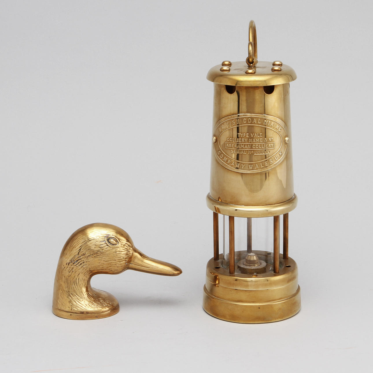 GRUVLYKTA samt KAPSYLÖPPNARE, mässing.