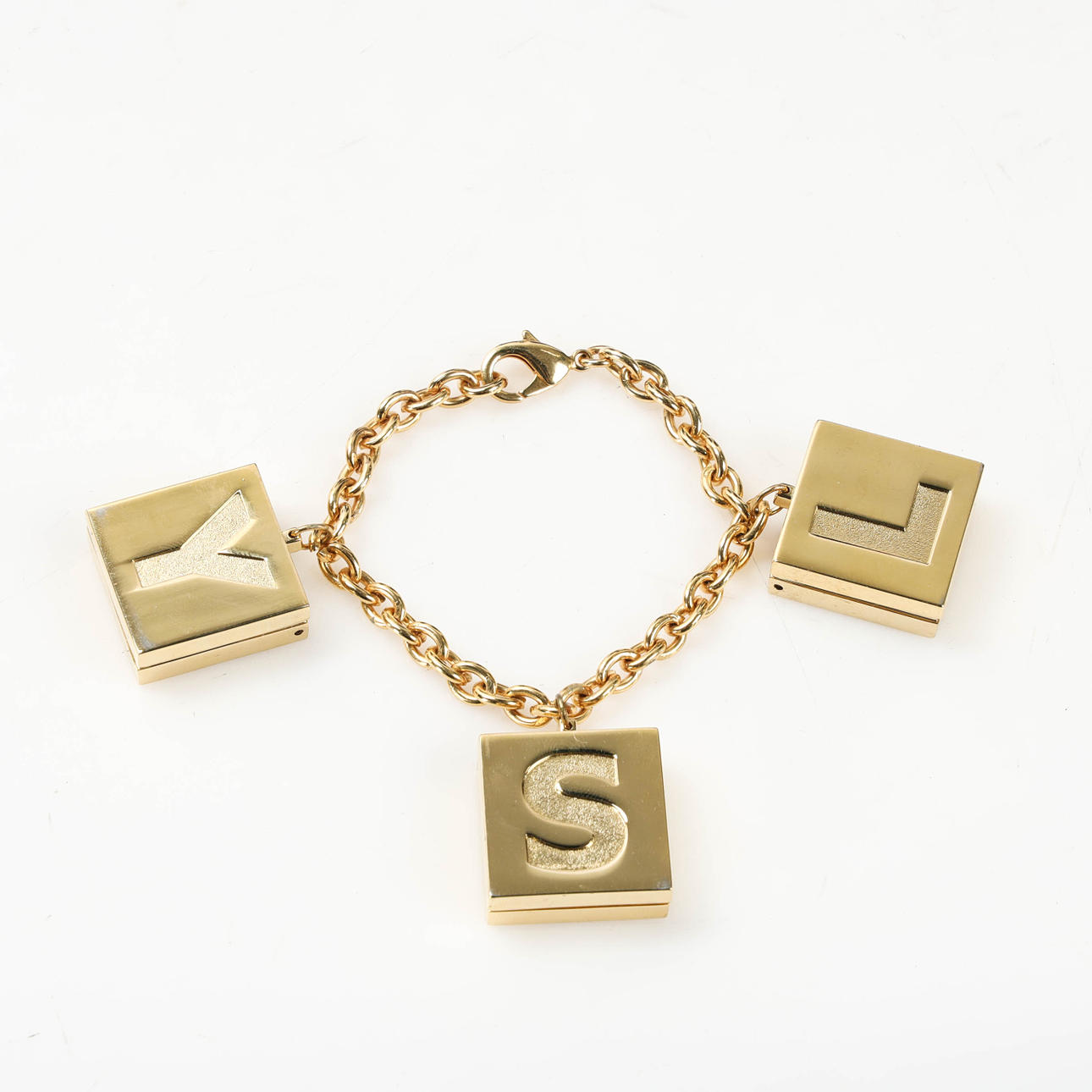 YVES SAINT LAURENT, Makeup charm bracelet, 1990s.