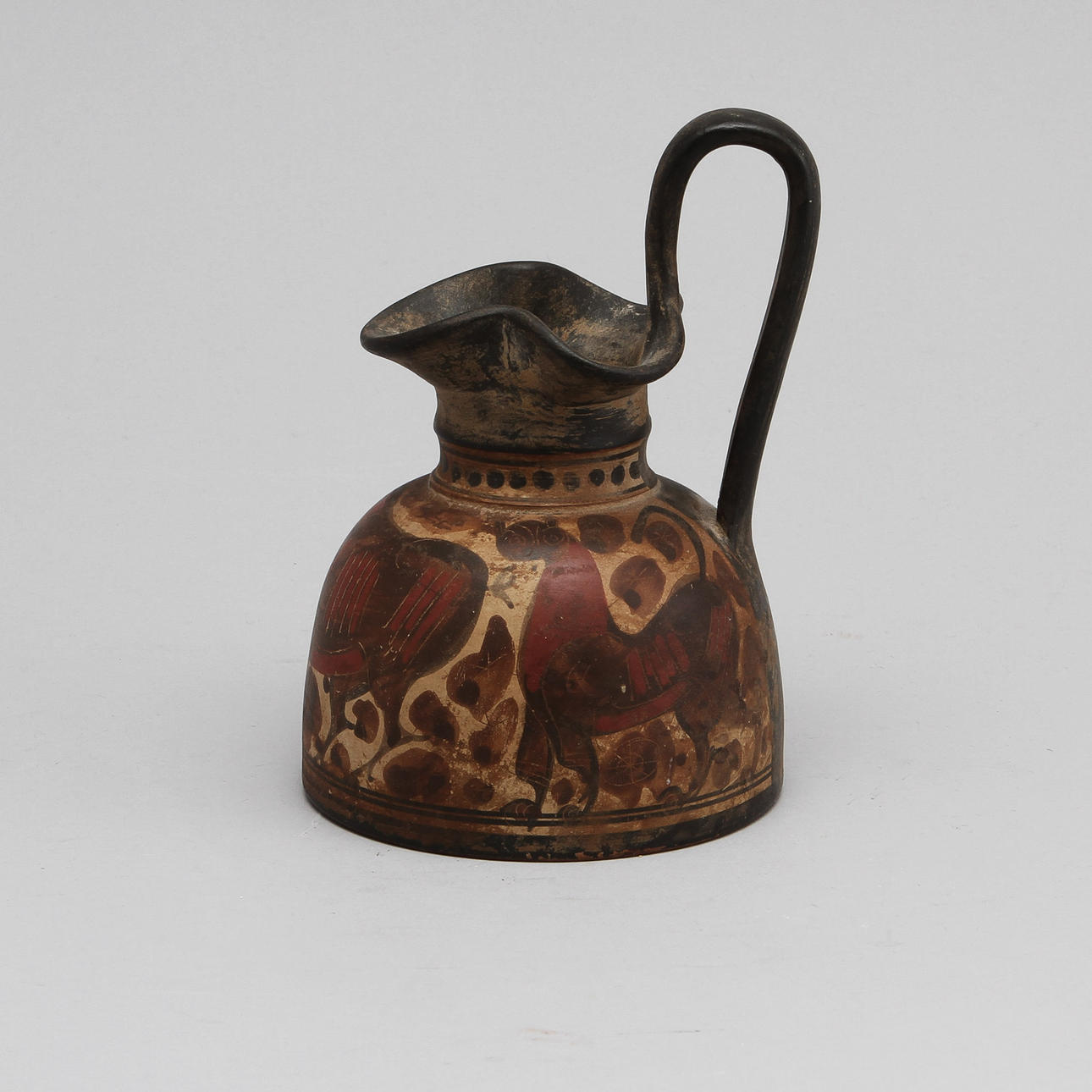 OINOCHOE, lergods. Italo-corintisk omkring 500 f.Kr.
