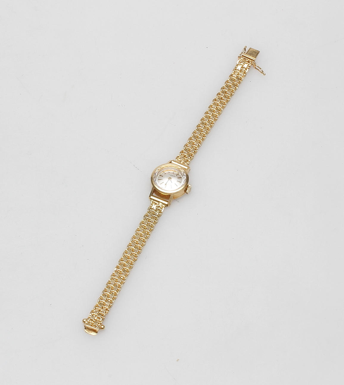 DAMARMBANDSUR MED ARMBAND, 18 k guld, Tissot, total vikt ca. 18,9 gram.