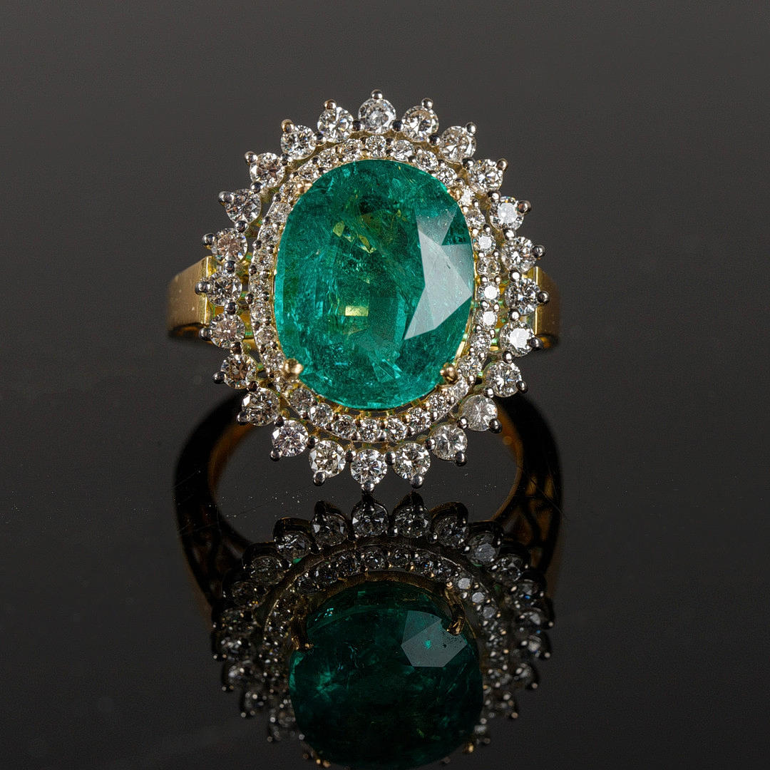 Emerald ring with diamonds.