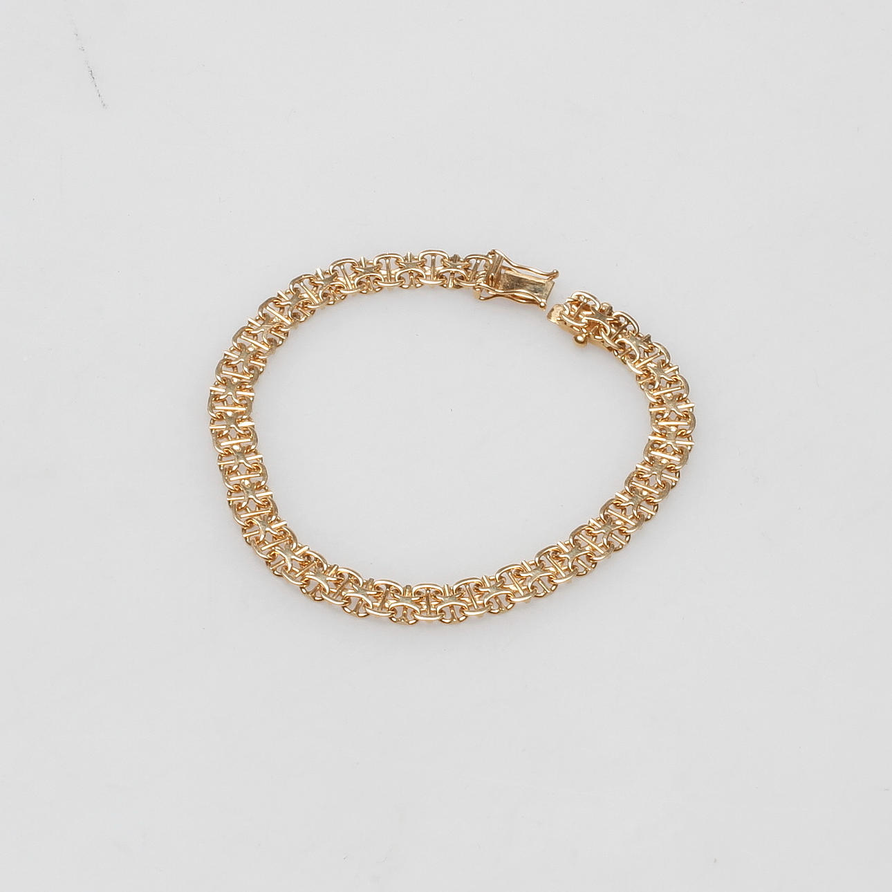 ARMBAND, "X-länk" 18 k, guld, vikt ca. 10,9 gram.