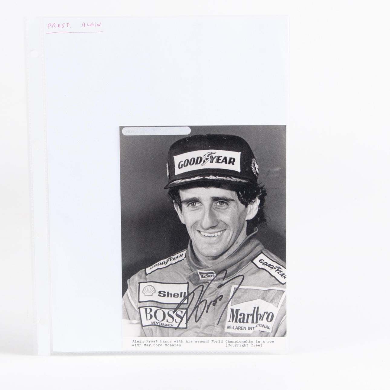 ALAIN PROST. Autograph on card.