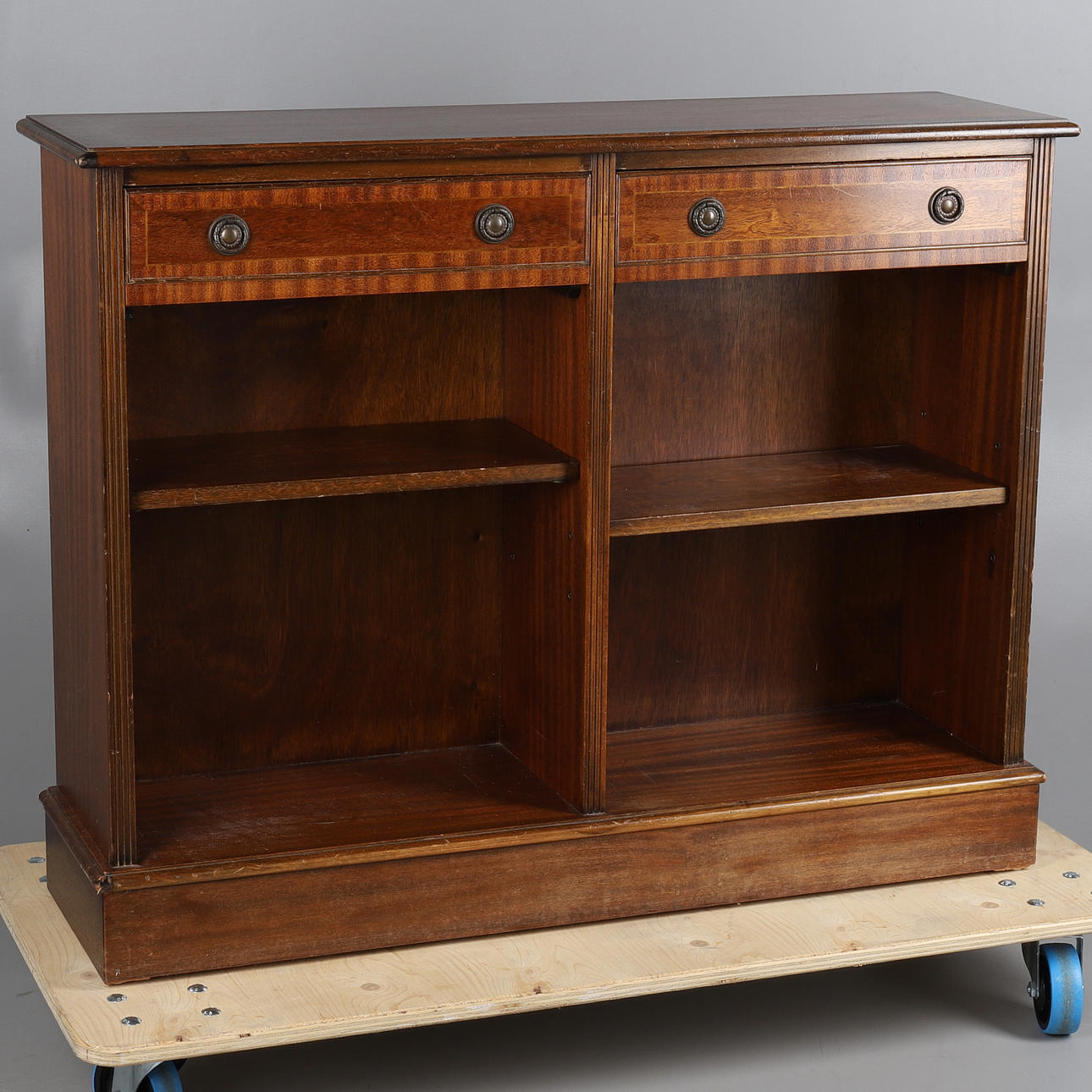 A REPRODUCTION MAHOGANY BOOKCASE.