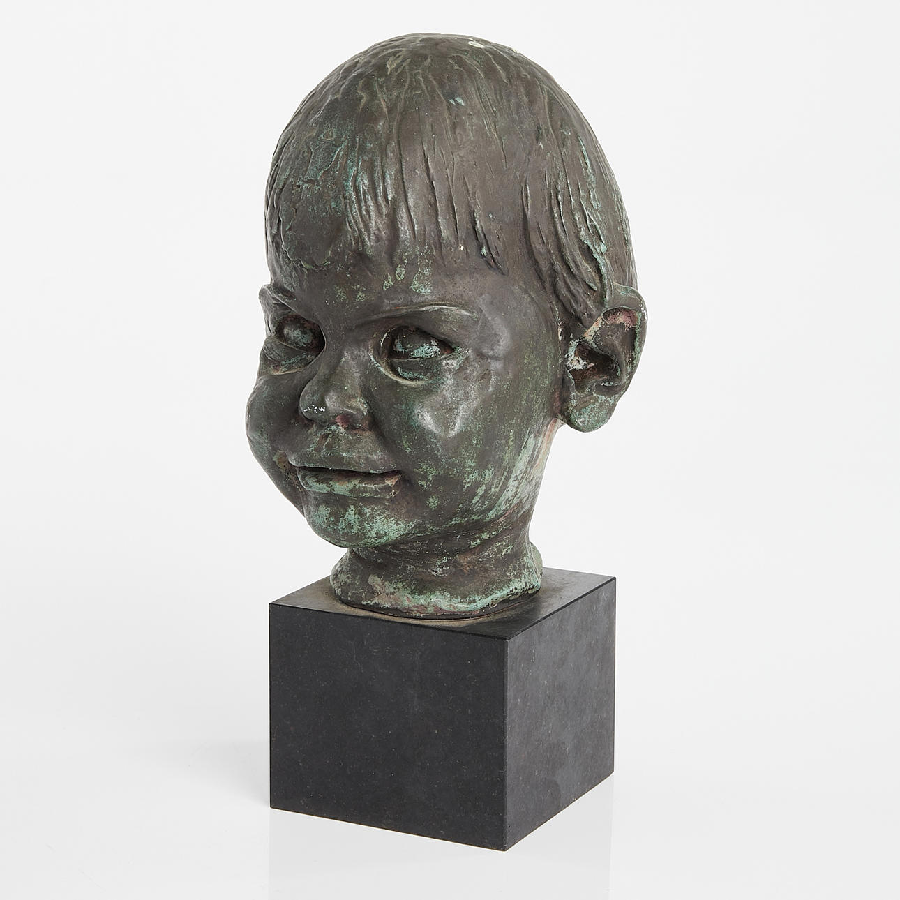 BRONZE BUST on stone plinth (20th century), indistinctly signed.