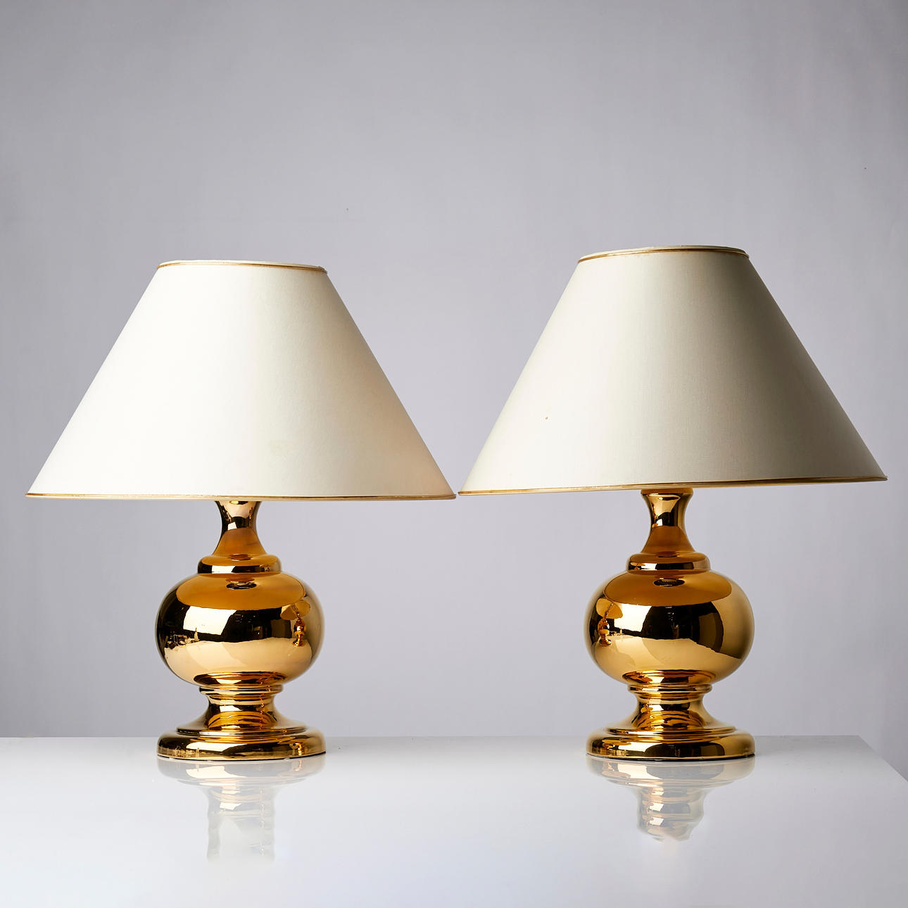 BITOSSI, table lamps, a pair, gold-glazed ceramic, labeled "Miranda AB".