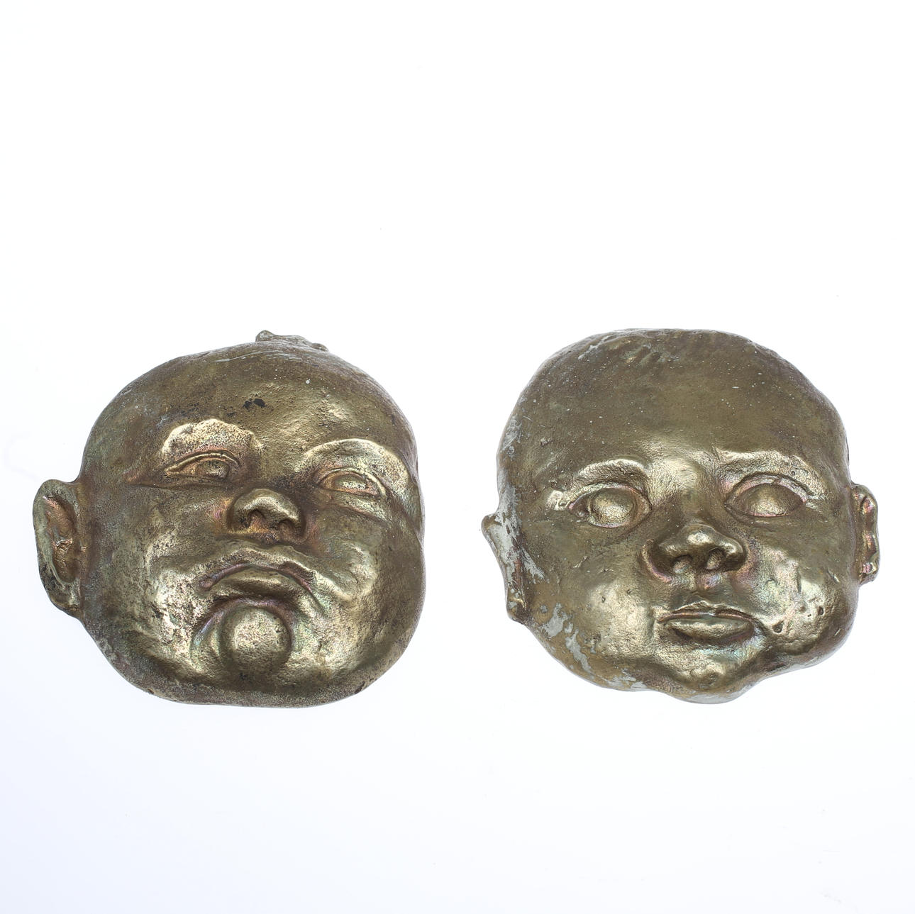 GUNNAR NILLSON. Reliefer i brons. 2 st. Barnansikte. Signerad G.N.