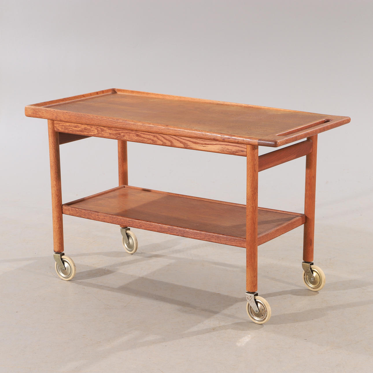 KURT ØSTERVIG. Serving trolley, oak, Jason Møbler, Denmark.