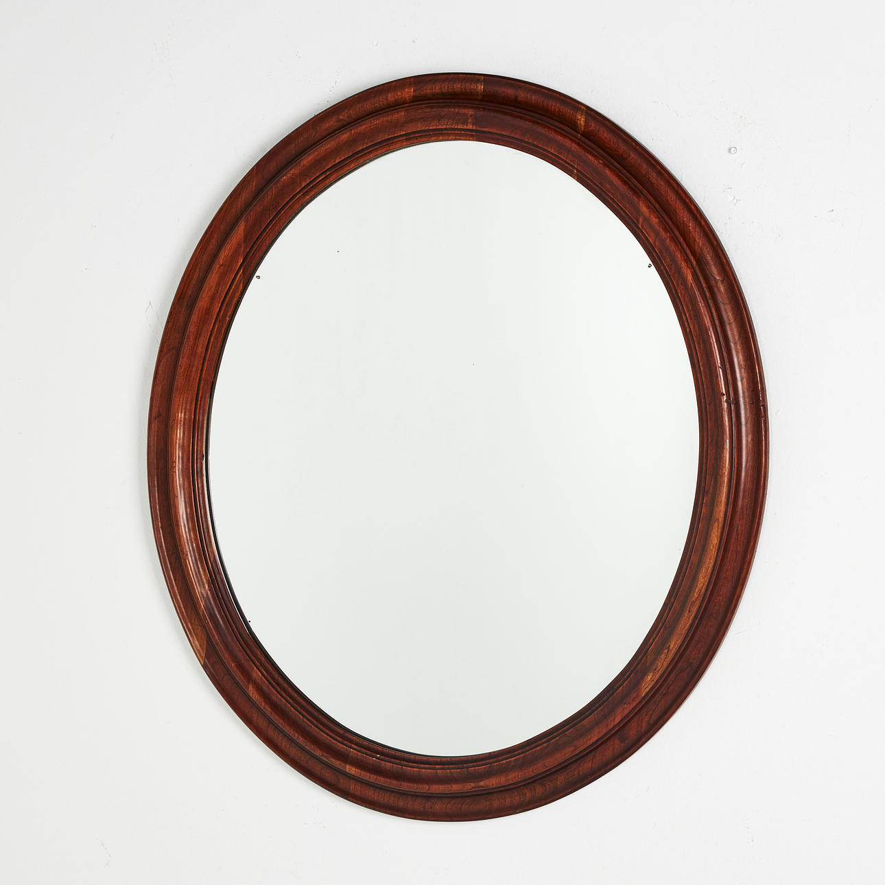 ESPEJO, 1900, forma ovalada, marco de caoba.