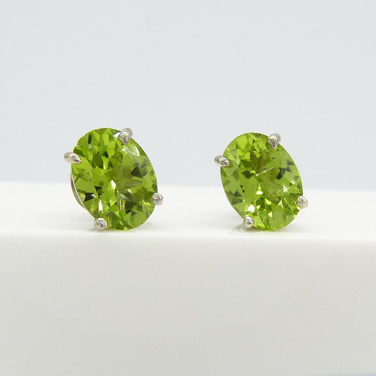 BOXED PERIDOT EARRINGS.
