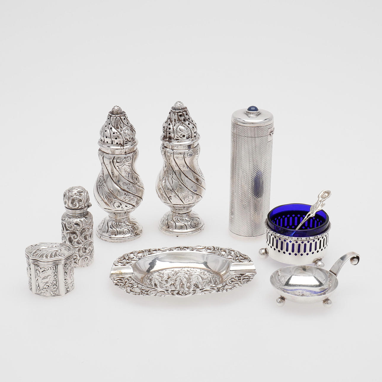 SILVER OBJECTS, 8 PIECES. box with embedded blue stone, spice sprinkler, flacon, ashtray and 2 salt shakers, including Sweden and England.