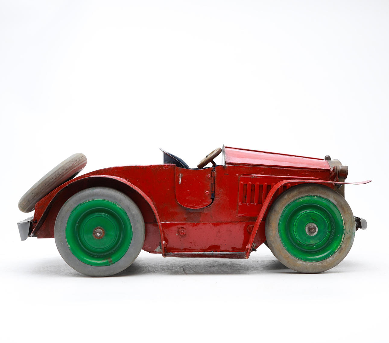 Painted tin toy car, circa 1930.