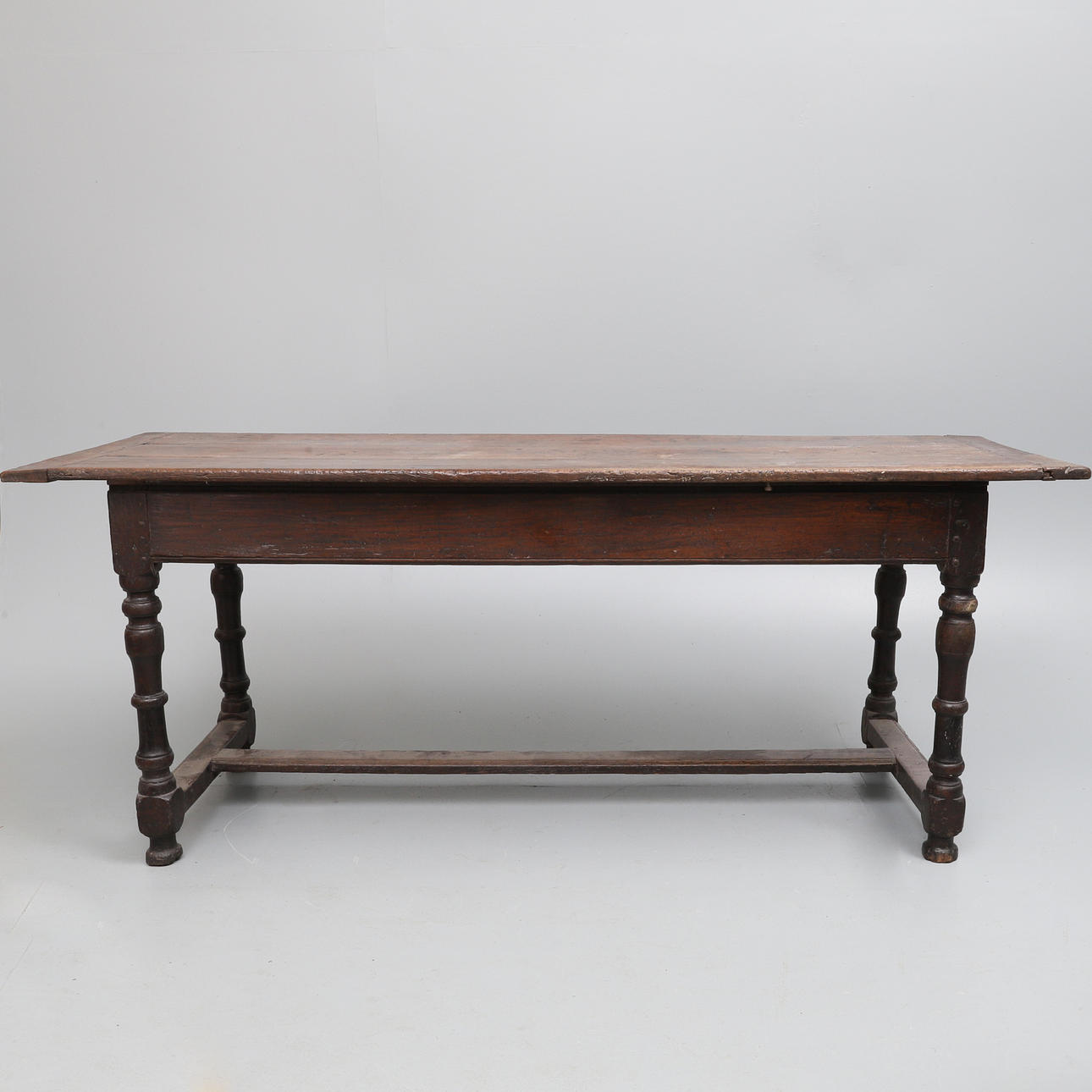 A 17TH CENTURY OAK REFECTORY TABLE.