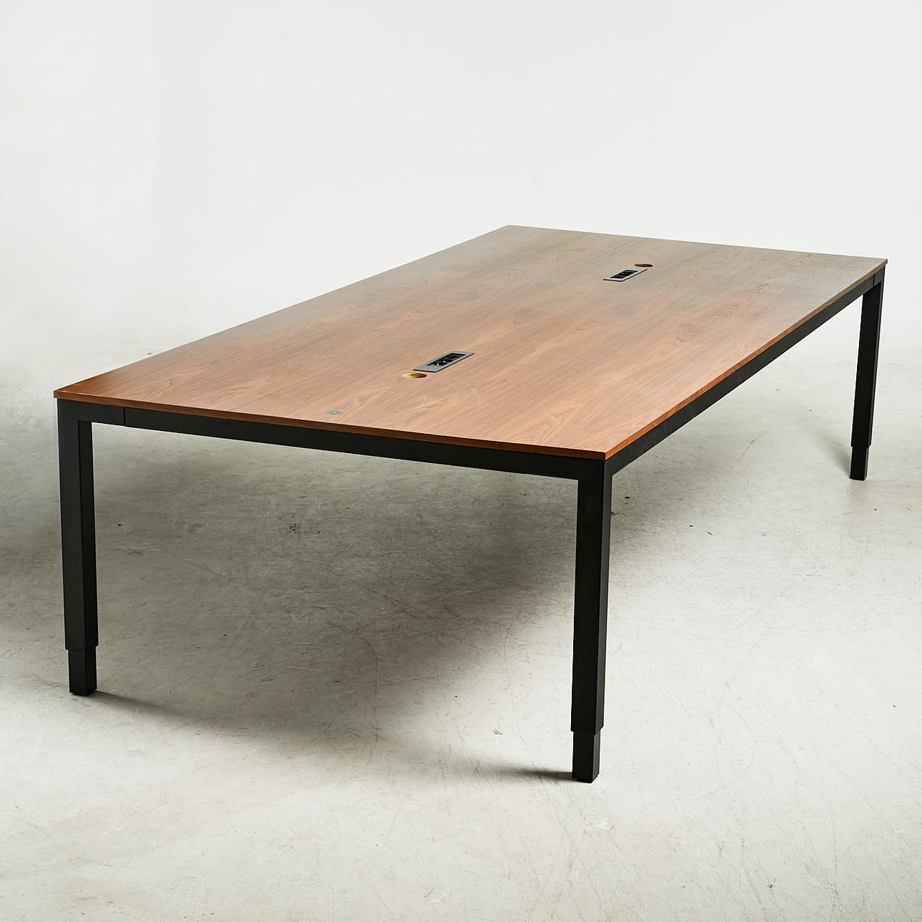 CONFERENCE TABLE, walnut, holes for cords, cord housing underneath, height and adjustable.