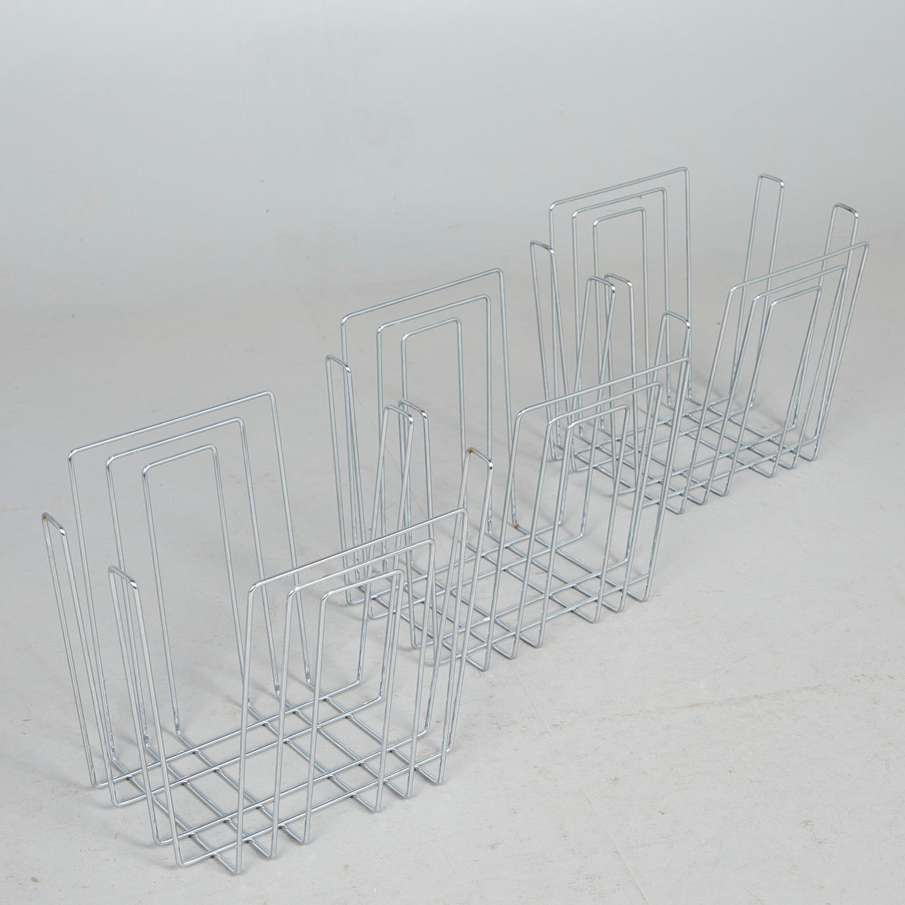 IN THE MANNER OF WILLI GLAESER. Three magazine racks / paper collectors ...