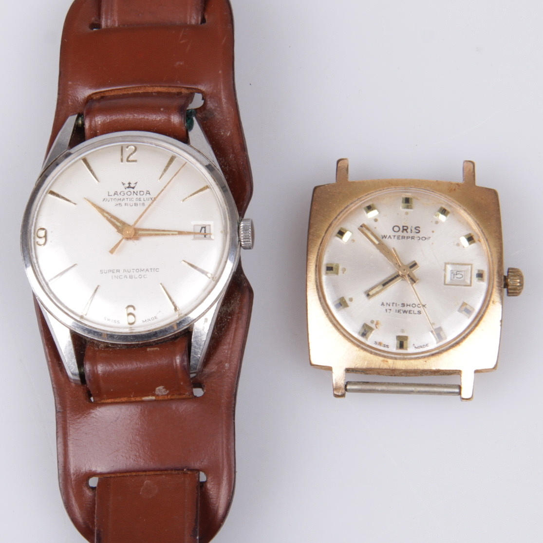 ARMBANDSUR, 2 st. Herr, Oris och Lagonda, 1900-tal.