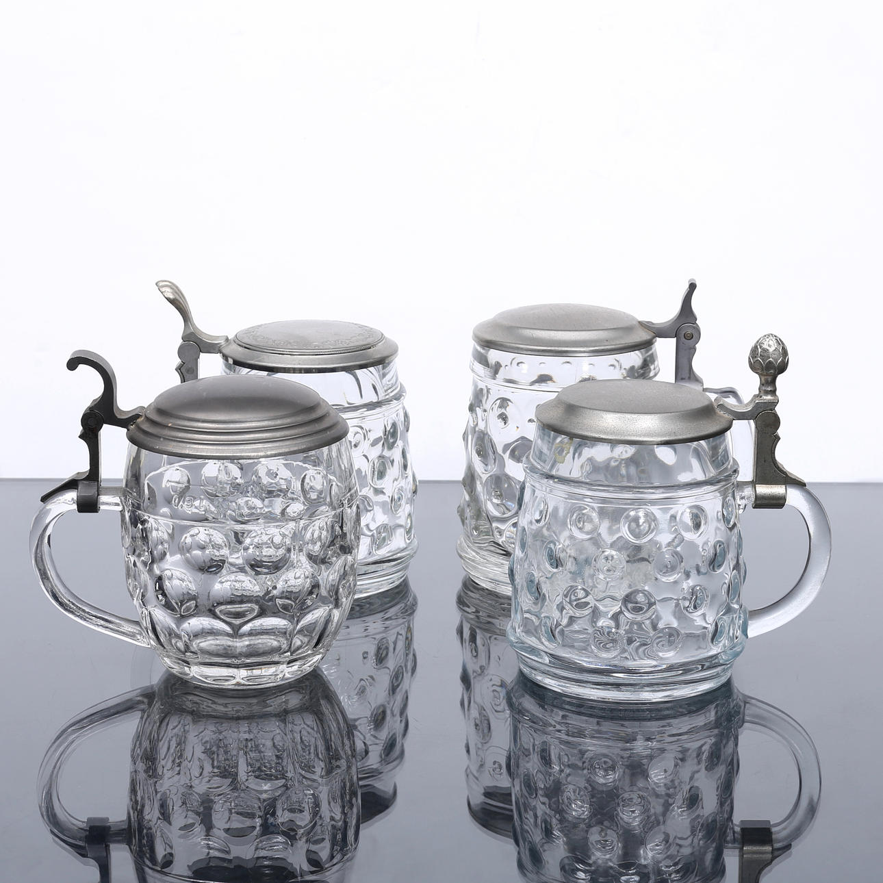 ØLSTOPPER, 4 stk., glas/metal, 1900-tallet.