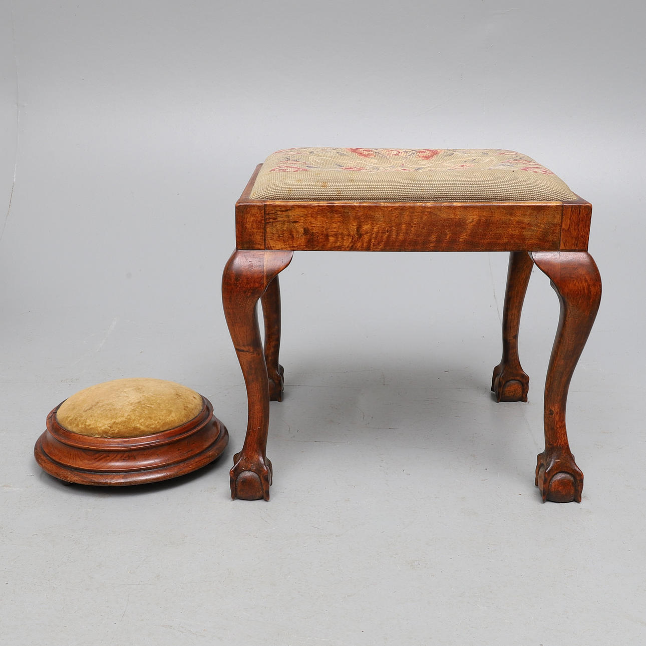 A VICTORIAN CIRCULAR WALNUT FRAME FOOTSTOOL, CIRCA 1860.