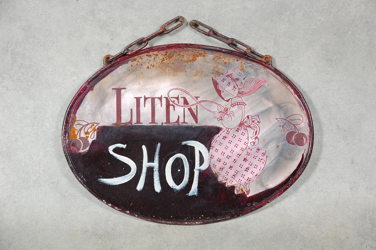 AFFÄRSSKYLT, smide, målad plåt, 1900-tal.