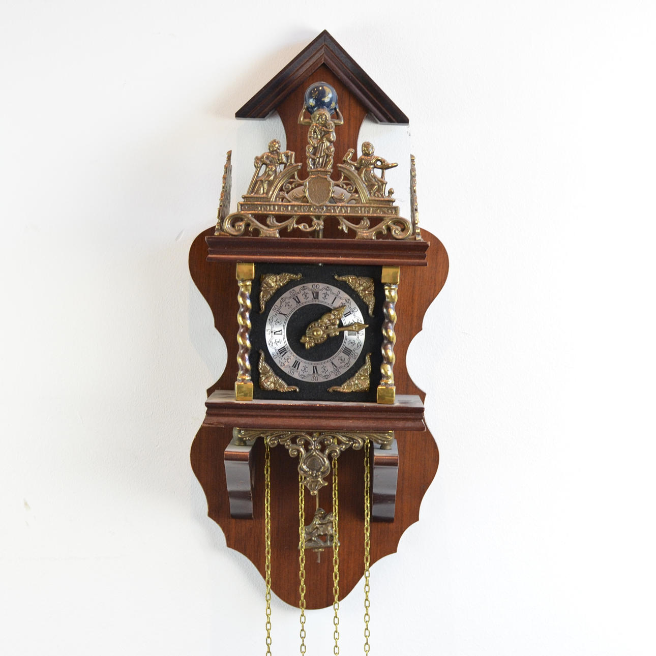 GROSSE HOLLAND WANDUHR - HOLZ MIT MESSINGAPPLIKEN.