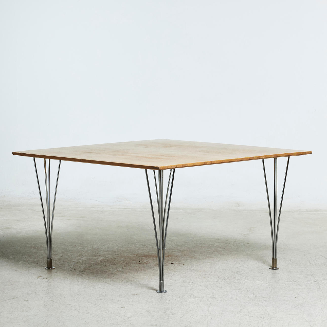 BRUNO MATHSSON & PIET HEIN. DINING TABLE, lower model, Masur birch, for Mathsson International AB, Fritz Hansen, Denmark, chromed legs.