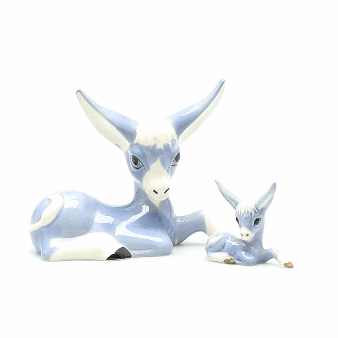 TWO MID-CENTURY JOSEPH SZEILER DONKEY FIGURINES.