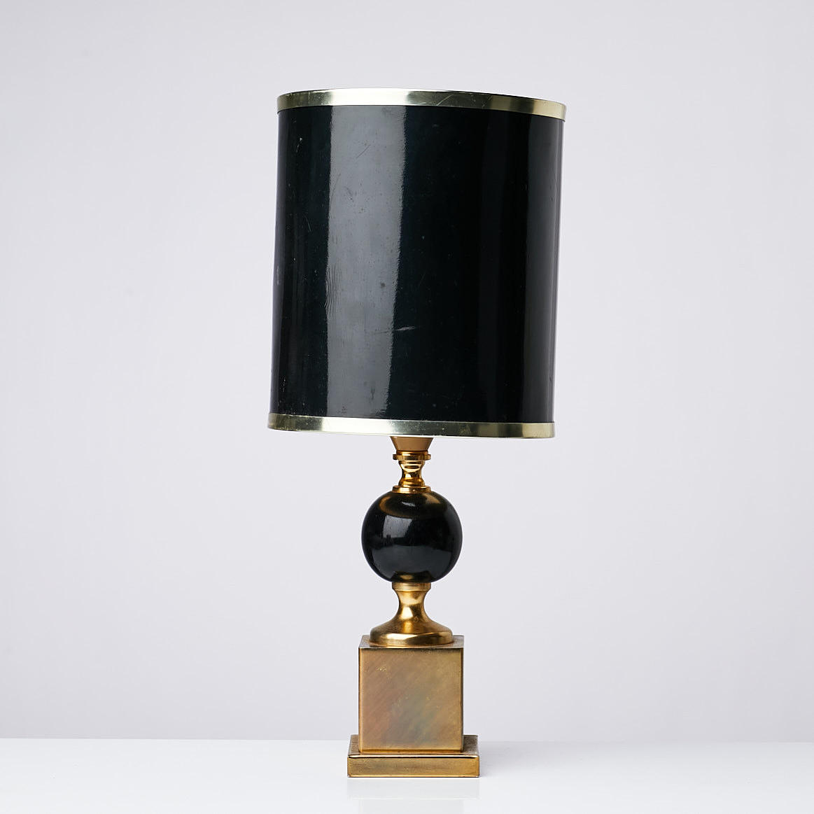 TABLE LAMP, brass, rectangular base, central stem decorated with blackened wooden globes, second half of the 20th century.