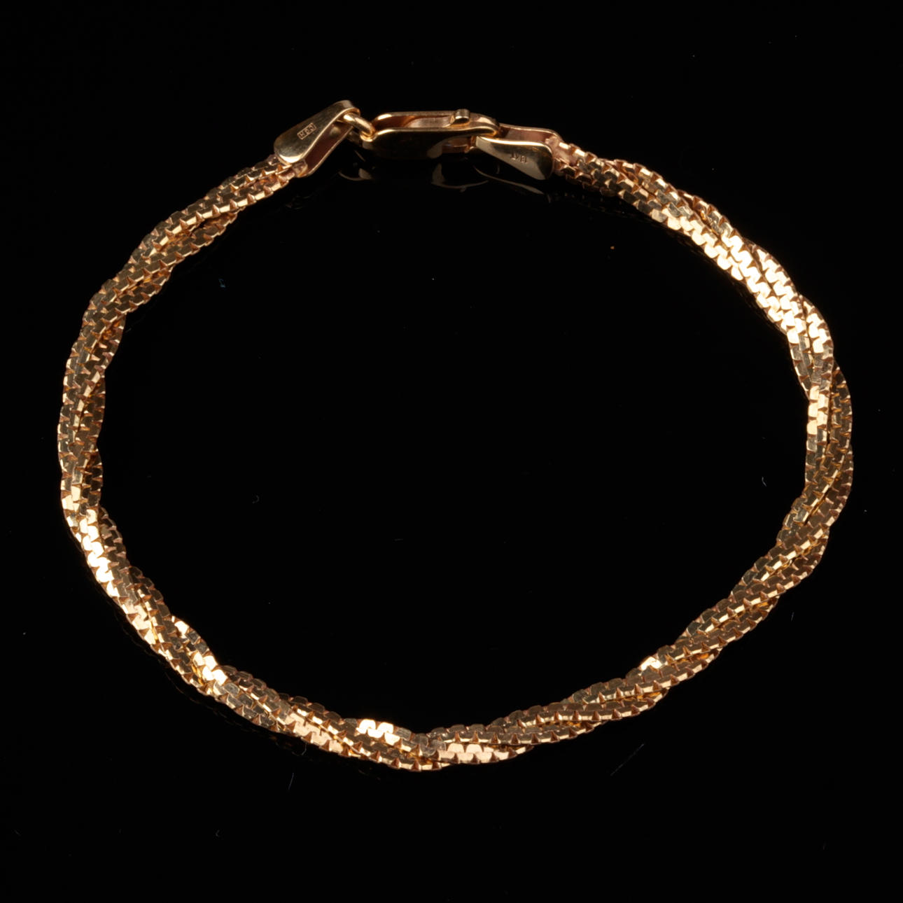 ARMBAND, tvinnad, 18k guld, CGH, vikt ca 6,95 gram.