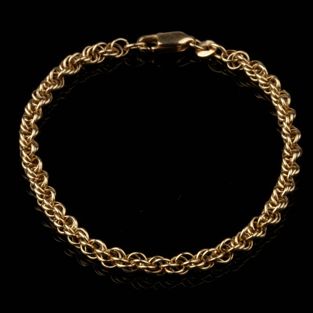 ARMBAND, tvinnad länk, 18k guld, vikt ca 5,22 gram.