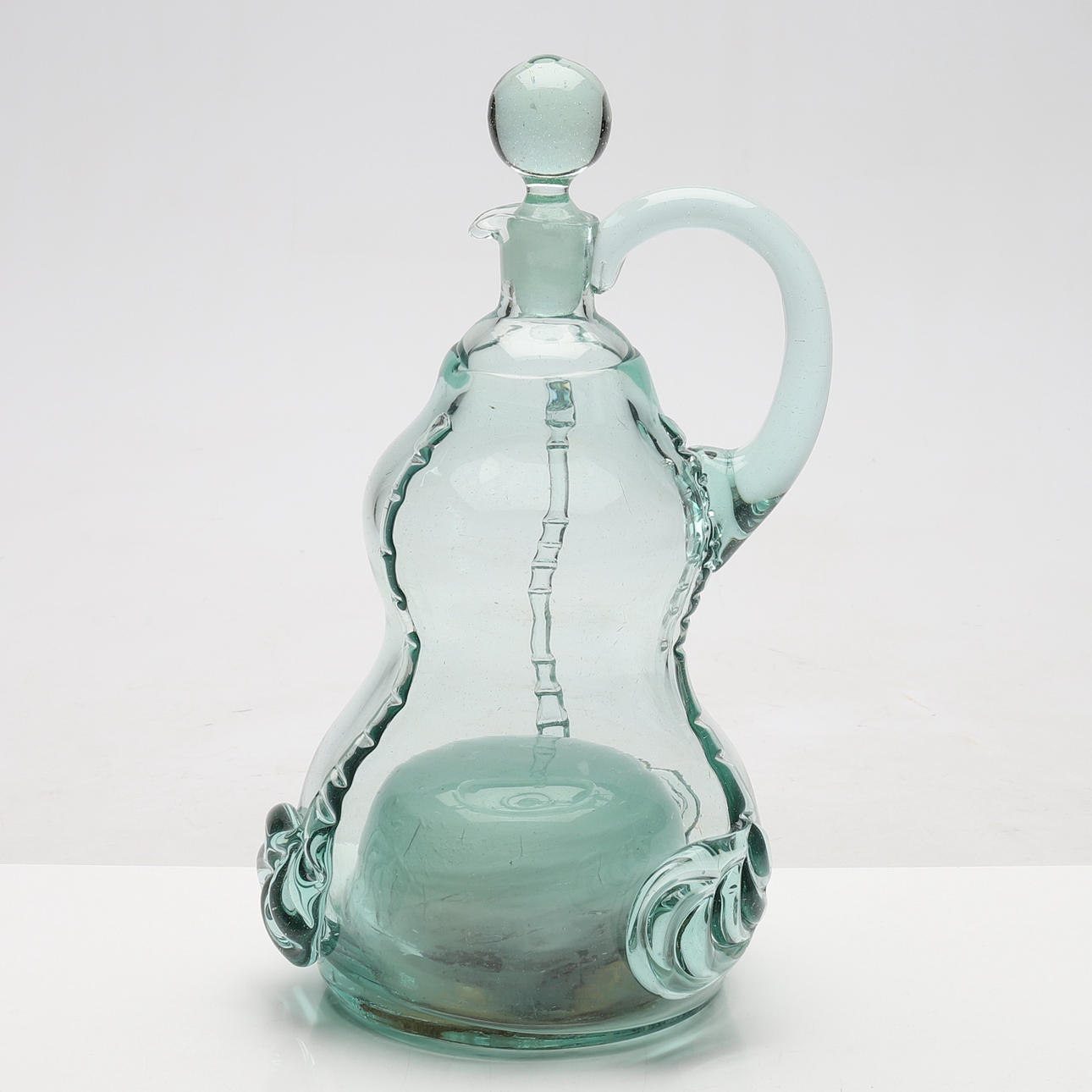 CARAFE WITH MUSIC BOX, glass, 1900s.