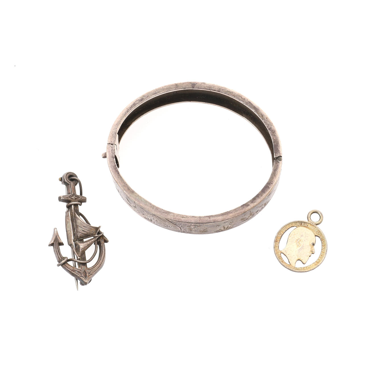 A VICTORIAN SILVER HINGED BANGLE.