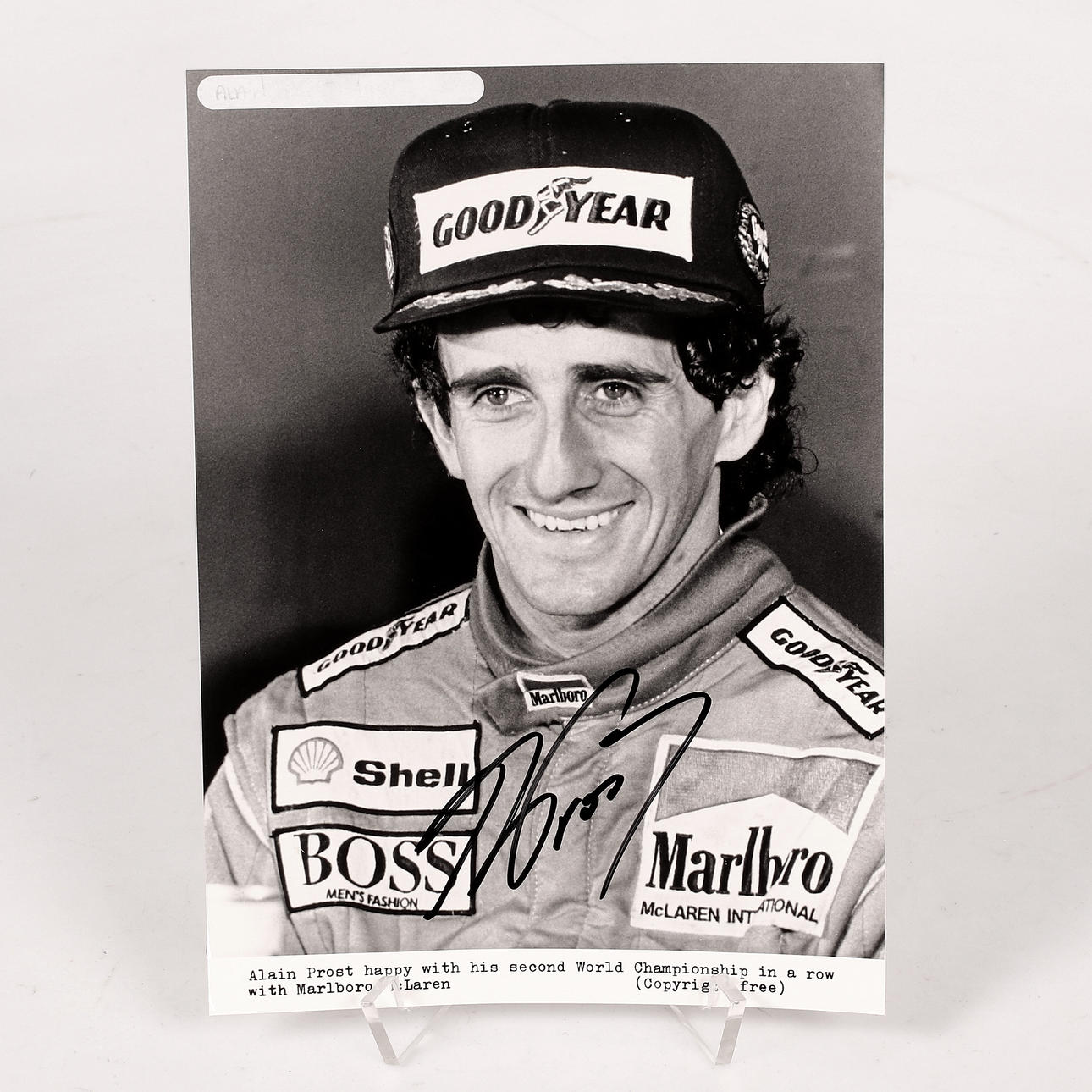 ALAIN PROST. Autograph on card.