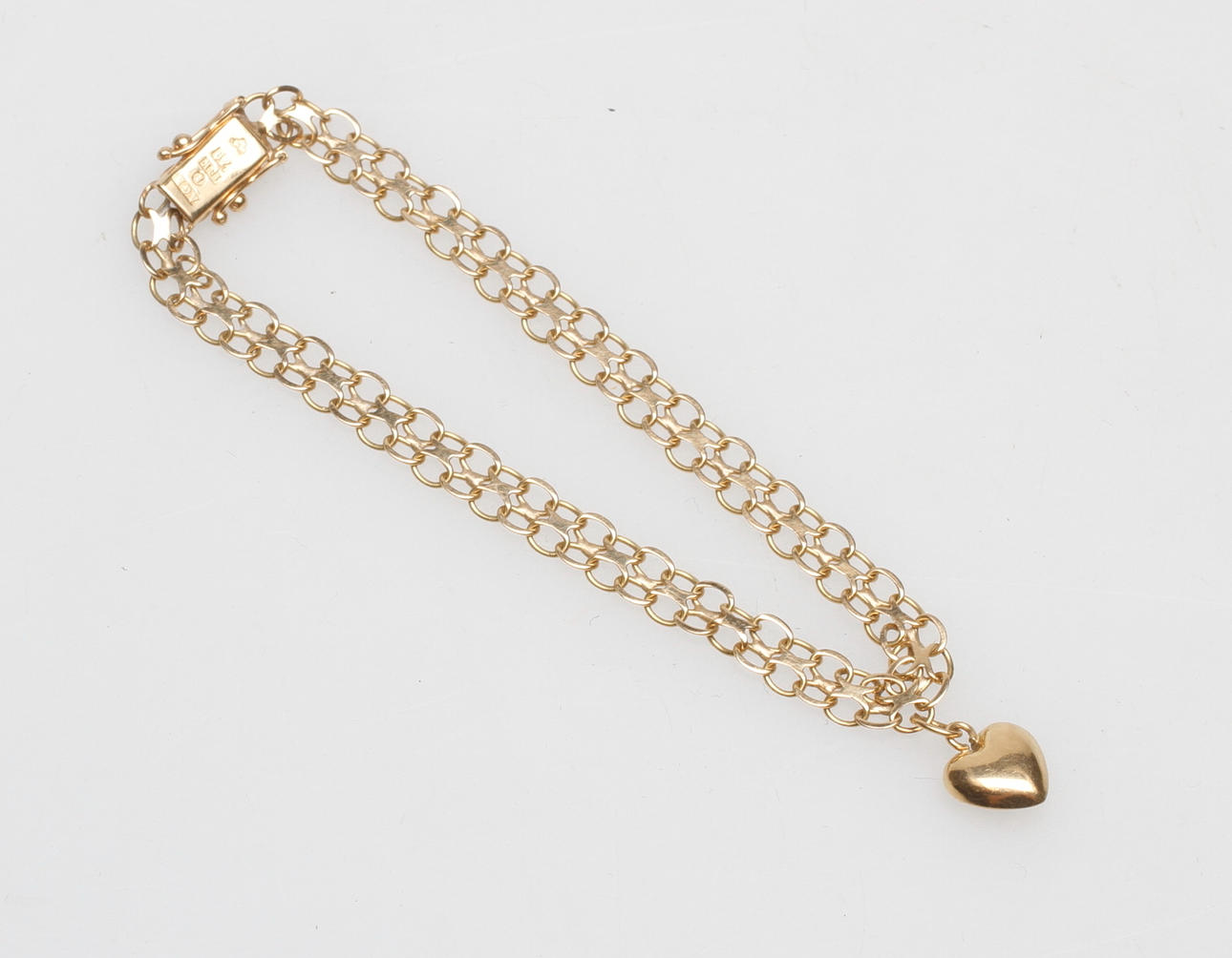 ARMBAND X-LÄNK samt EN BERLOCK, 18k guld, vikt ca 5,8 gr.