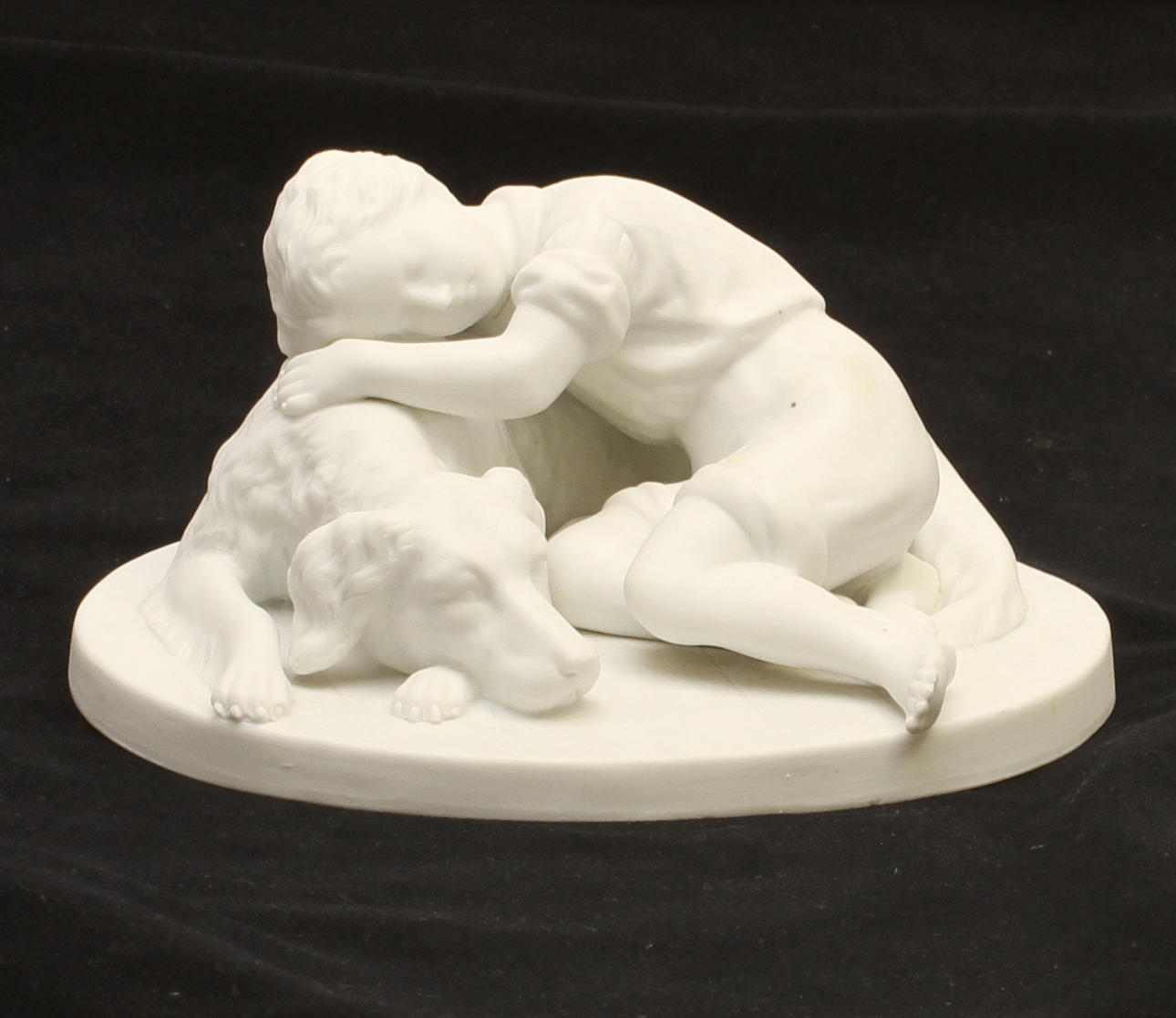 FIGURIN, parian, "Hund med pojke", A Rudenschöld, Gustavsberg, dat 1896.