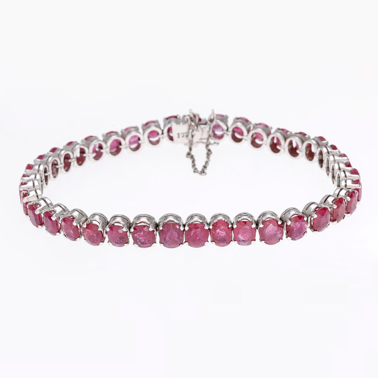 Silver and rubies rivière bracelet.