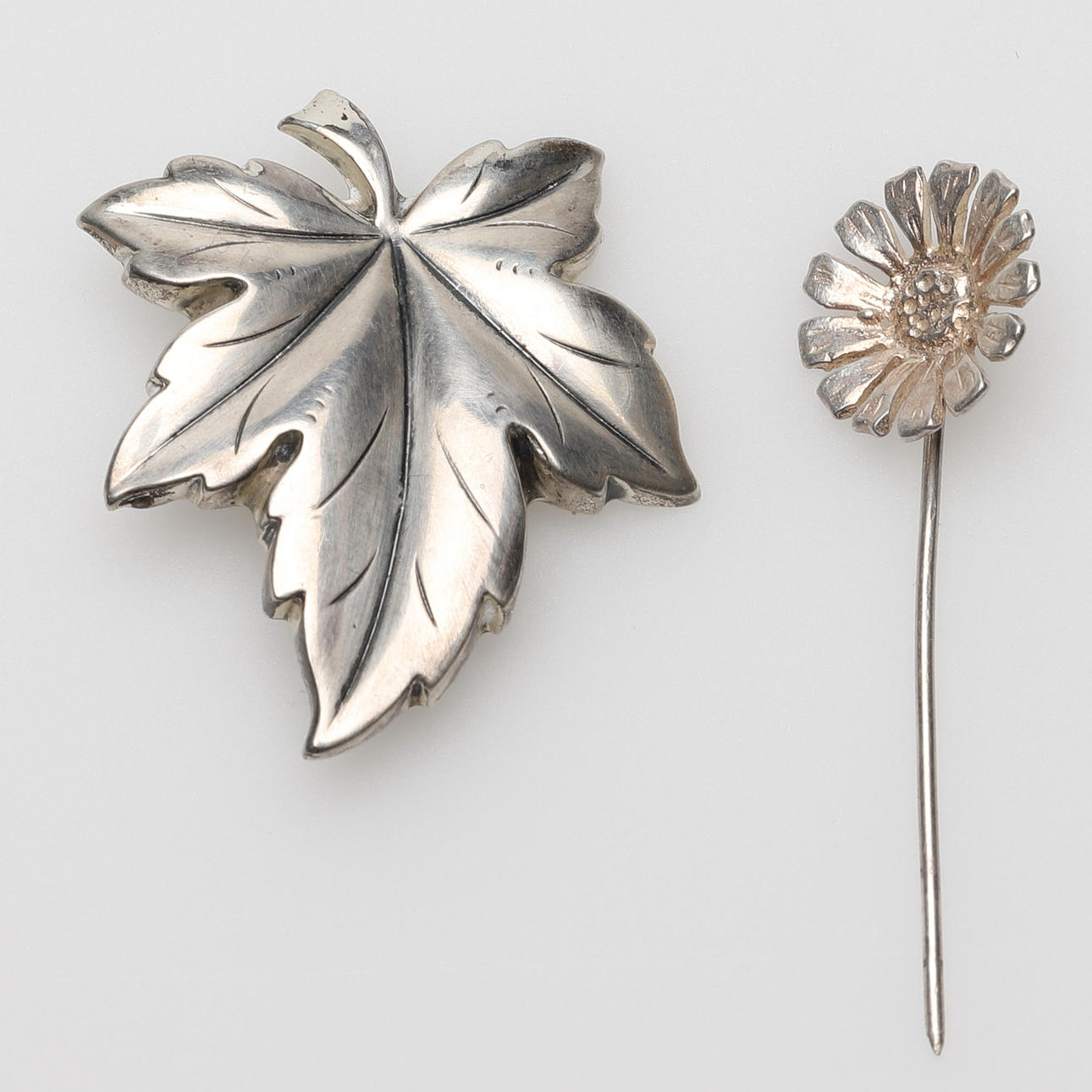 BROOCHES, 2 pcs, silver, b.a. Theodor Klotz.