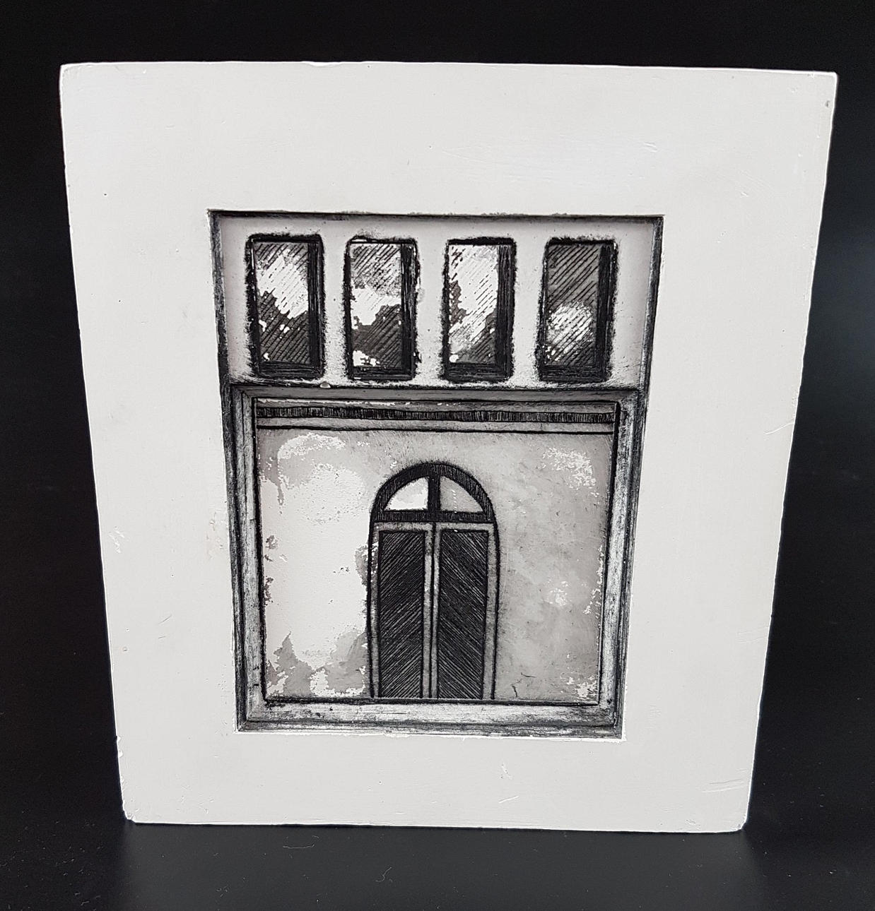 - UTA HEINE. Windows and front door cast in plaster.