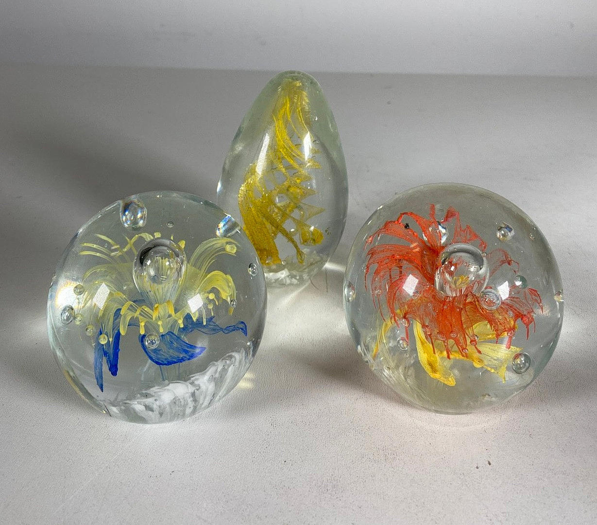 Paperweights, glass, 3 pieces.