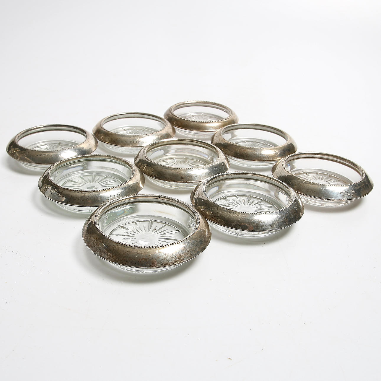 GLASUNDERLÄGG/COSTERS, 9 st, Sterling, Frank M. Whiting.